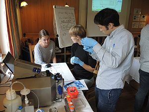 Cyrielle, Amanda and Satoshi trying to run the first experiment by themselves